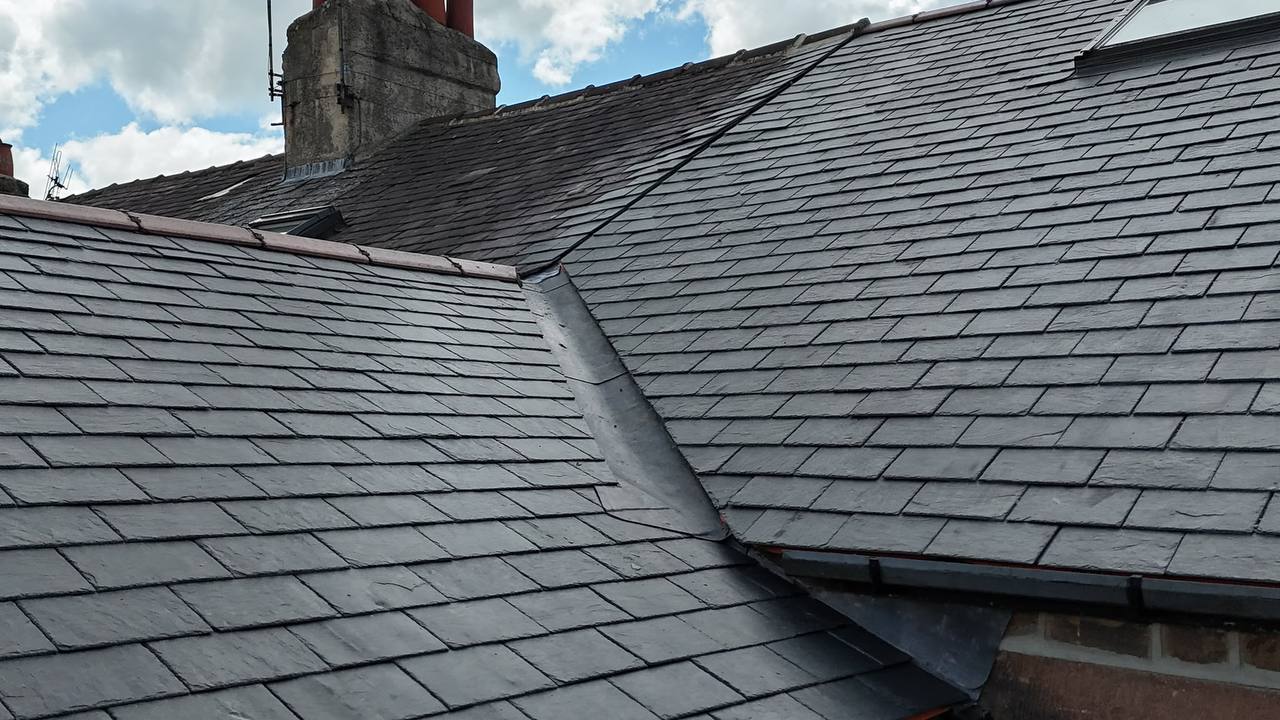 Brown tiled pitched roof installation