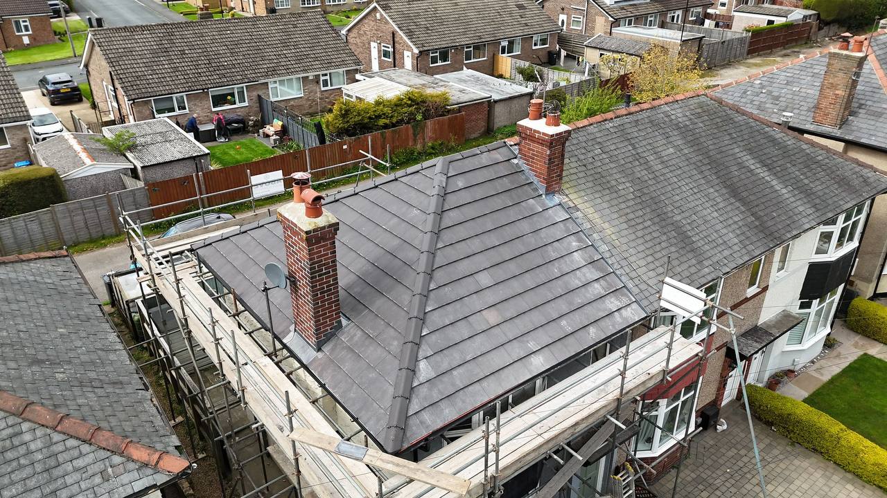 Flat rubber roof with clear blue sky